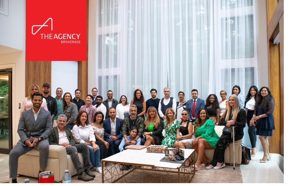 Peter Torkan with The Agency Toronto team in the office he built